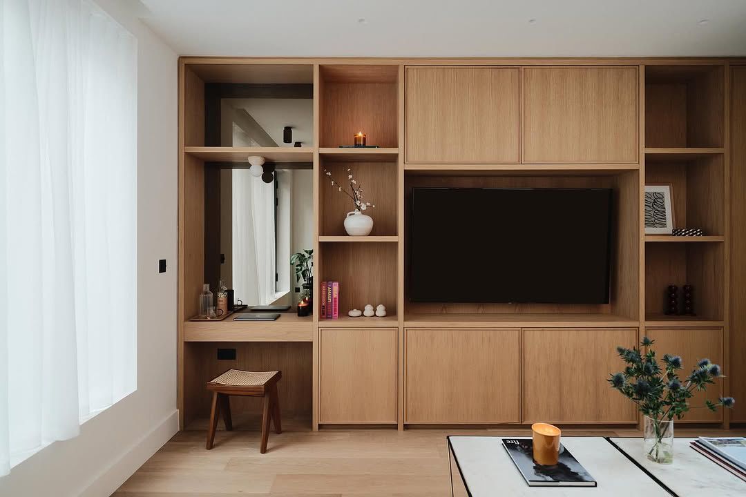 Bespoke oak media wall with integrated desk and shelving